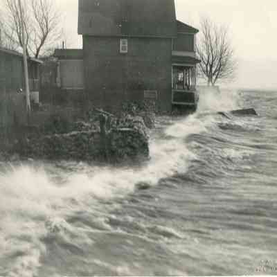 Waves crashing again shoreline, alternate angle.