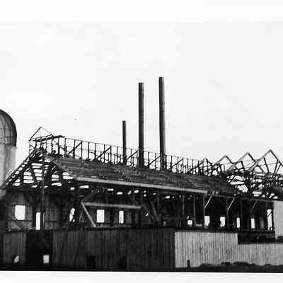 Building Under Construction Next to Silo