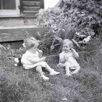 Two Children With Flowers