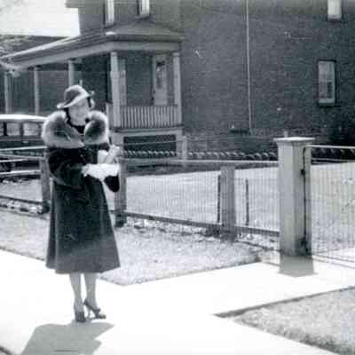 Women in front of fence