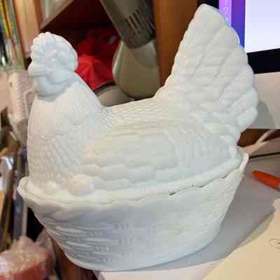 1.9.25c Opaline Milk Glass Hen on Nest – Possibly Antique French Carousel 1 Opaline Milk Glass Hen on Nest – Possibly Antique French Carousel 2 Opaline Milk Glass Hen on Nest – Possibly Antique French Carousel 3 Opaline Milk Glass Hen on Nest – Possibly Antique French Carousel 4 Opaline Milk Glass Hen on Nest – Possibly Antique French Carousel 5 Opaline Milk Glass Hen on Nest – Possibly Antique French Carousel 6 Opaline Milk Glass Hen on Nest – Possibly Antique French Carousel 7 Opaline Milk Glass Hen on Nest – Possibly Antique French Carousel 8 Opaline Milk Glass Hen on Nest – Possibly Antique French Carousel 9 Opaline Milk Glass Hen on Nest – Possibly Antique French Carousel 10 Description Recycle, Reuse, ReLove! Please make an offer via the ‘Questions’ panel below Thank you for your support of a purely NZ-owned small business A finely detailed and beautifully moulded opaline milk glass hen-on-nest covered dish, likely dating to the late 19th or early 20th century. The bluish tinge to the thinner glass edges and the soft internal glow of the opaline are consistent with early French production. These dishes were traditionally used to serve eggs or sweets. M E A S U R E S : Height: 19.5 cm Length: 22 cm Width: 18 cm C O N D I T I O N : Displays very well but has two noted flaws. There is a chip to the rim of the base dish (nest), and another chip to the base of the hen where it seats into the bowl. Both are shown clearly in the photographs and do not affect overall stability or display. P L E A S E N O T E : Please review all photos carefully, as they form an important part of the item description. We cannot be held liable for any damage incurred during transit. ref 1.9.25c Details Condition: Used Shipping & pick-up options Destination & description	Price Courier - Wellington $7.20 Courier - Wellington > Rural $14.01 Courier - Rest of North Island $25.85 Courier - Rest of North Island > Rural $31.74 Courier - South Island $46.00 Courier - South Island > Rural $51.89 Seller does not allow pick-ups Learn more about shipping & delivery options. Payment Options Pay instantly by card, Ping balance or saved bank account. What's Ping? Four fortnightly interest-free payments. What's Afterpay? Other options Cash, NZ Bank Deposit Questions & Answers thunderbirdvtg enter comment 500 characters remaining Do not use this feature to bypass the auction process or for commercial purposes. Abuse may result in suspension of your account. No questions have been asked! Opaline Milk Glass Hen on Nest – Possibly Antique French