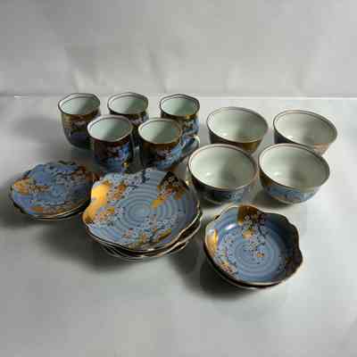 2.10.25a Vintage Japanese Tea Set with Gilded Sakura Blossom Decoration – 19-Piece Carousel 1 Vintage Japanese Tea Set with Gilded Sakura Blossom Decoration – 19-Piece Carousel 2 Vintage Japanese Tea Set with Gilded Sakura Blossom Decoration – 19-Piece Carousel 3 Vintage Japanese Tea Set with Gilded Sakura Blossom Decoration – 19-Piece Carousel 4 Vintage Japanese Tea Set with Gilded Sakura Blossom Decoration – 19-Piece Carousel 5 Vintage Japanese Tea Set with Gilded Sakura Blossom Decoration – 19-Piece Carousel 6 Vintage Japanese Tea Set with Gilded Sakura Blossom Decoration – 19-Piece Carousel 7 Vintage Japanese Tea Set with Gilded Sakura Blossom Decoration – 19-Piece Carousel 8 Vintage Japanese Tea Set with Gilded Sakura Blossom Decoration – 19-Piece Carousel 9 Vintage Japanese Tea Set with Gilded Sakura Blossom Decoration – 19-Piece Carousel 10 Vintage Japanese Tea Set with Gilded Sakura Blossom Decoration – 19-Piece Carousel 11 Description Recycle, Reuse, ReLove! Please make an offer via the ‘Questions’ panel below Thank you for your support of a purely NZ-owned small business A beautifully hand-decorated vintage Japanese porcelain tea set, comprising 19 assorted pieces including cups, saucers, and small bowls. The set includes a mix of saucers, cups with and without handles, and dessert bowls, all with scalloped rims and variations in form that reflect artisanal production. The design is reminiscent of Kutani or Satsuma-inspired export ware, likely mid-20th century (c. 1950s–70s). All items are marked to the base with a Japanese maker's stamp (unidentified). The style suggests production for export, possibly from Arita or another key porcelain centre. M E A S U R E S: Large saucers x4 Height: 2 cm Small saucers x3 Height: 1 cm Diameter: 10.5 cm High saucers x2 Height: 3 cm Diameter: 10.5 cm Cups (4 without handle, 1 with handle) Height: 7.2 cm Diameter: 6 cm Bowls x4 Height: 5.3 cm Diameter: 9 cm C O N D I T I O N: Good vintage condition. No chips, cracks, or restorations noted. Minor wear to gilt detailing consistent with age and use. Please refer to photos for detailed views of decoration and condition. P L E A S E N O T E: We recommend carefully reviewing the provided photos as they are integral to the item's description. We cannot be held liable for any damages that may occur during transit. Ref: 2.10.25a Details Condition: Used Shipping & pick-up options Destination & description	Price Courier - Wellington $7.20 Courier - Wellington > Rural $14.01 Courier - Rest of North Island $25.85 Courier - Rest of North Island > Rural $31.74 Courier - South Island $46.00 Courier - South Island > Rural $51.89 Seller does not allow pick-ups Learn more about shipping & delivery options. Payment Options Pay instantly by card, Ping balance or saved bank account. What's Ping? Four fortnightly interest-free payments. What's Afterpay? Other options Cash, NZ Bank Deposit Questions & Answers thunderbirdvtg enter comment 500 characters remaining Do not use this feature to bypass the auction process or for commercial purposes. Abuse may result in suspension of your account. No questions have been asked! Vintage Japanese Tea Set with Gilded Sakura Blossom Decoration – 19-Piece