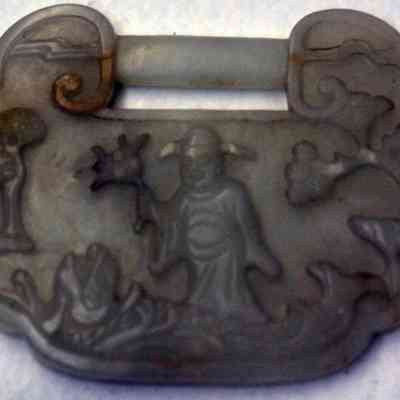White jade pendant with carved figure