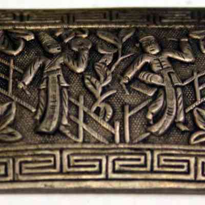 Silver repousse pin with two musician figures