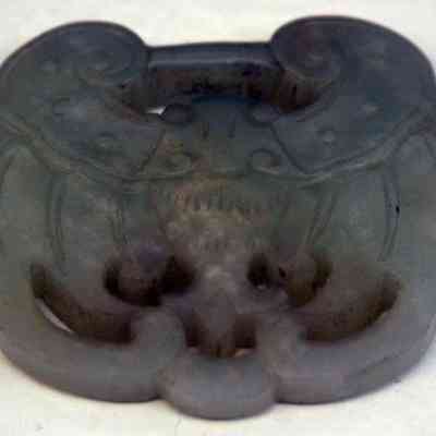 White jade pendant with perforations and crab form
