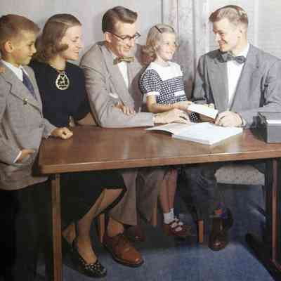 1946 – A	FAMILY GIVING TITHES TO THE CHURCH TREASURER