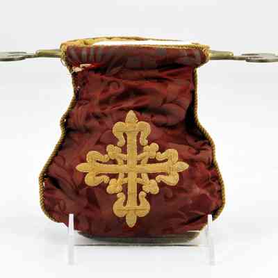 13,513 - OFFERING BAG WITH BRASS OPPOSING HANDLES AND GOLD EMBROIDERED INSIGNIA