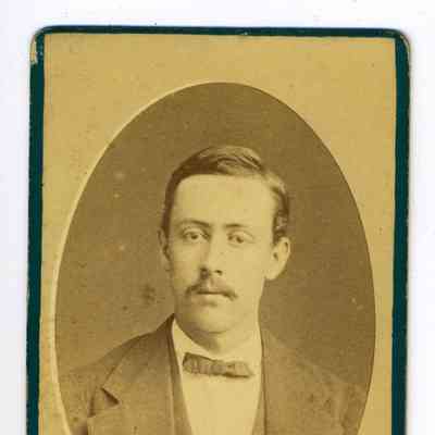 Studio photograph of a man with a mustache