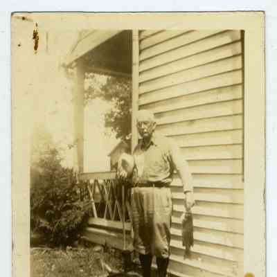 Photograph of an older man holding a fish