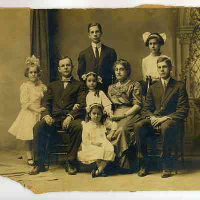 Studio photograph of a couple with 4 girls and two older boys