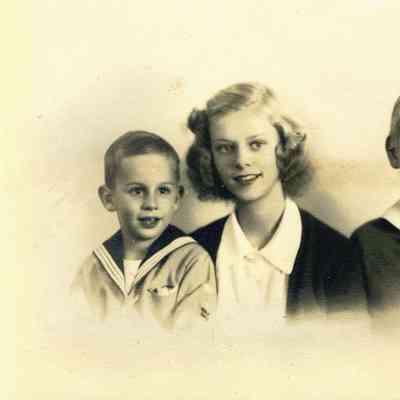 Studio photograph of 2 young boys and a young girl