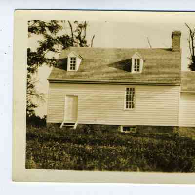 Photograph of a back of a house - before and after exterior remodeling