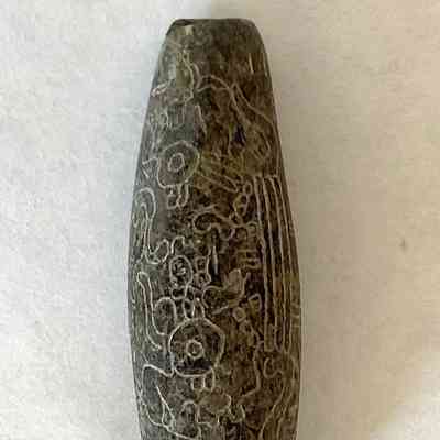 STONE BEAD WITH ETCHED FIGURES