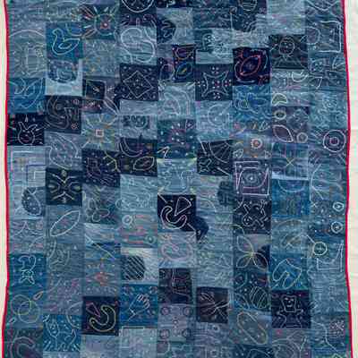 EMBROIDERED DENIM QUILT (SIGNED "100 AGE")