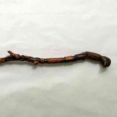 CANE WITH CARVED FIGURES AND SYMBOLS