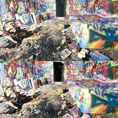HC2. Fig. 2. Antechamber with modern graffiti. The plaster wall has been removed in sections visible at left.