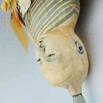 Juliellen Byrne, Toe Tag (detail): Bottom, smaller head on Toe Tag with praying hands on top