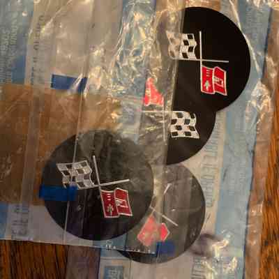 76-79 wheel hub emblems set of 4 GM NOS