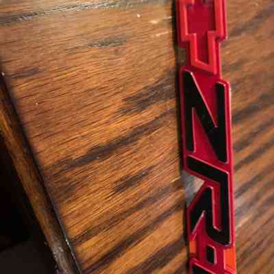 90-95 zr-1 corvette emblem 10198688 nos red/black