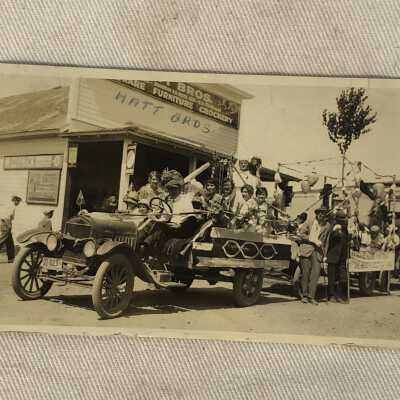 Parade Postcard infront of Hatt Bros
