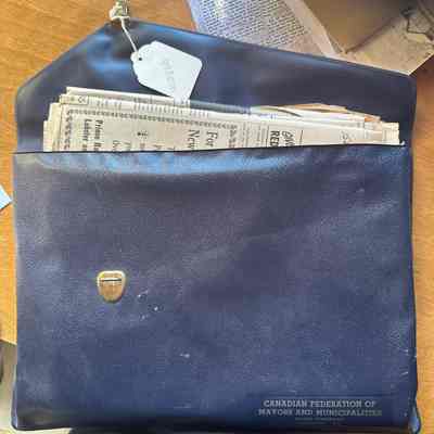 Leather encasing, various newspapers