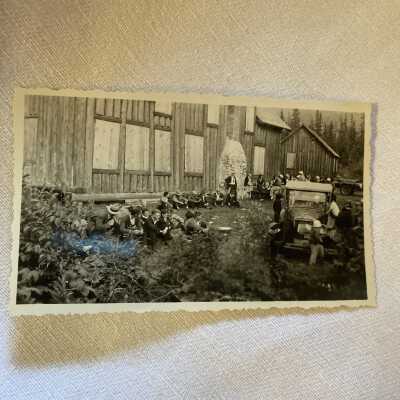 Group sitting in front of Cabin