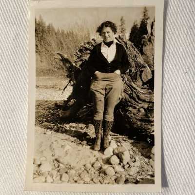 Woman standing on river bank