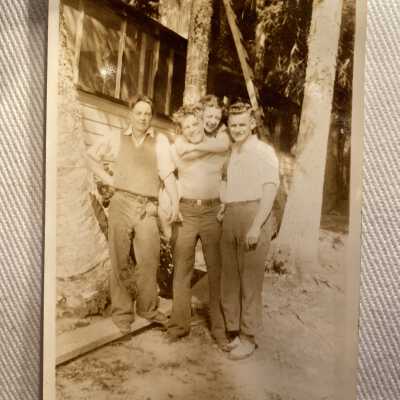 Four People in front of Cabin