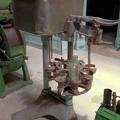 Bottle filling and capping machine