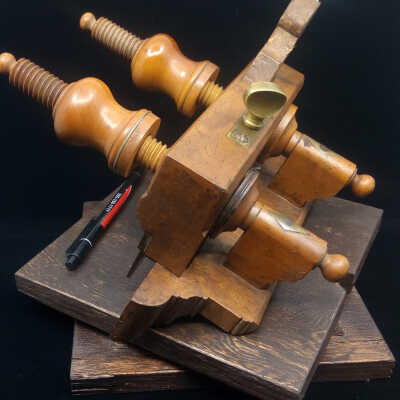The diamond shape brass nuts for the fence holding screws show.  Note also the ornamental moulding of the fence.