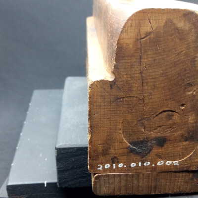 Rear face, battered with metal hammer to loosen cutter/wedge.