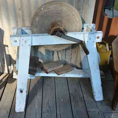 Grinding wheel on stand.