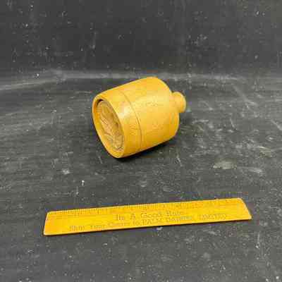small wooden butter mold and press