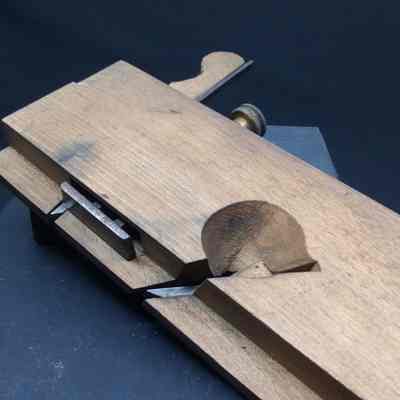 Escapement Side showing Depth Stop: Depth stop is adjusted by thumb screw on top.