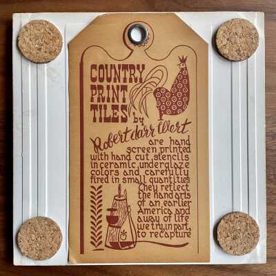 Tile back with Country Print Tiles label hanger and cork pads.