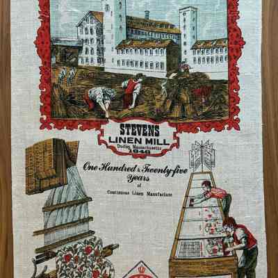 A 1972 towel commemorating Stevens Linens’ 125th anniversary. Production of the first calendar towel is illustrated, lower right corner.: PKM collection.