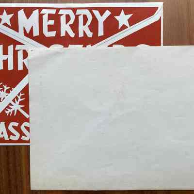 Two mailing envelopes with printed backs and blank fronts.