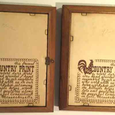 Back of framed prints with Country Prints imprints and item numbers written in pencil.