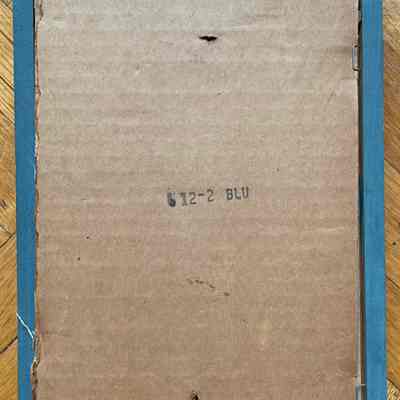 Back of frame with item number and frame color in black ink.