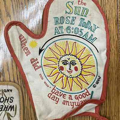 Motif Gourmet, Good Day, Orange oven mitt.: Collection of the Gill Historical Commission. Image: Michael J. Dawson.