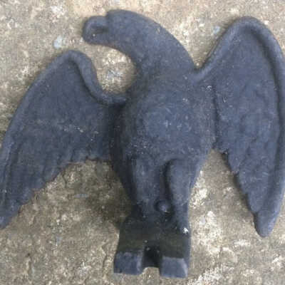 Left, third from top, cast iron eagle snowbird.: The black eagle in Wert’s design may represent a cast iron eagle snowbird. Image: i.ebayimg.com