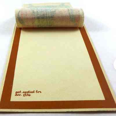 Patent application notice on card face under linen print.: Image: overthetopoverstock, Etsy.com.