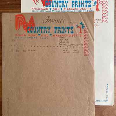 Comparison of design revisions between the silkscreen printed brown kraft paper and the tan laid paper.