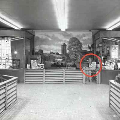 Country Prints display at the Big East Fair. Pack board on display within red oval.: Collection of Sara Leeper.