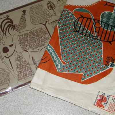 Calico Kitchen 452 Barn Red tablecloth and packaging.