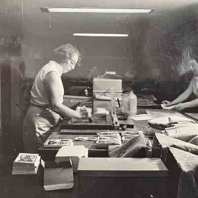 Painted Tin notecards in production at the Country Prints workshop.: Image: Collection of Sara Leeper. Image: unidentified photographer and media source.