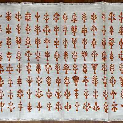 Napkin: copper print on white linen.