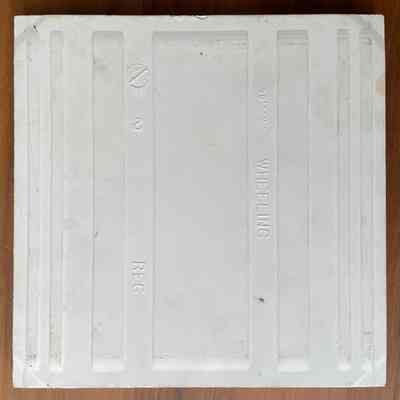 Tile back, with manufacturer’s mark and date (56).