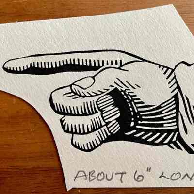 Manicule or pointing hand art: 2 1/2” w x 1 1/4” h.: Also known as a “printer’s fist”.