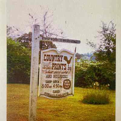 Country Prints road sign on River Road, 1.5 miles from Country Prints.: Image: Collection of Sara Leeper.